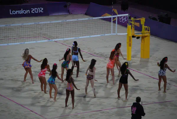 Bikini babes perform during the beach volleyball event to keep the crowd entertained